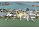 Waterfront lot with a pool and dock in a desirable neighborhood offers stunning water views at 575 Crystal Dr, Madeira Beach, FL 33708