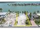 Aerial view of the property highlighting the location next to a canal, dock, and waterfront at 575 Crystal Dr, Madeira Beach, FL 33708