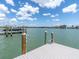 Well-maintained dock on a waterfront with boat lifts, offering easy access to the open water at 575 Crystal Dr, Madeira Beach, FL 33708