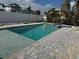 Inviting pool and spa with brick pavers, perfect for outdoor entertaining at 575 Crystal Dr, Madeira Beach, FL 33708