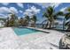 The beautiful pool and dock create an inviting backyard oasis at 575 Crystal Dr, Madeira Beach, FL 33708