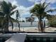 View of the backyard pool area and private dock from the water at 575 Crystal Dr, Madeira Beach, FL 33708