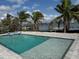 A beautiful pool and outdoor patio with views of the bay and private dock at 575 Crystal Dr, Madeira Beach, FL 33708