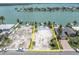 Aerial view of a lot with waterfront views and a pool at 575 Crystal Dr, Madeira Beach, FL 33708