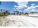 Expansive vacant lot showing the property's potential for a new home or development at 575 Crystal Dr, Madeira Beach, FL 33708