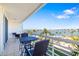 Relax on this balcony with chairs and enjoy a stunning view of the water and a blue sky at 6061 Bahia Del Mar Cir # 442, St Petersburg, FL 33715