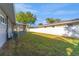 Spacious backyard with well-maintained lawn, privacy fence, and screened patio at 6835 114Th St, Seminole, FL 33772