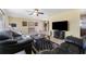 Cozy living room featuring ceramic tile floors, a ceiling fan, and a view of the kitchen and dining areas at 6835 114Th St, Seminole, FL 33772