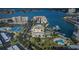 Aerial view of the community with marina, pool, and tennis courts along the intercoastal waterway at 7645 Sun Island S Dr # 201, South Pasadena, FL 33707