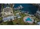 Aerial view of a pool, boat dock, shuffleboard court and condo building at 7645 Sun Island S Dr # 201, South Pasadena, FL 33707