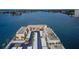 Aerial view of waterfront community with palm trees, community features and lush landscaping at 7645 Sun Island S Dr # 201, South Pasadena, FL 33707