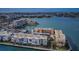 Gorgeous aerial view of waterfront condo community with palm trees and well-maintained landscaping at 7645 Sun Island S Dr # 201, South Pasadena, FL 33707