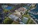 Aerial view of tennis courts, shuffle board court, marina and community buildings at 7645 Sun Island S Dr # 201, South Pasadena, FL 33707