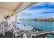 Charming outdoor living on balcony with views of waterfront, perfect for relaxing or entertaining guests at 7645 Sun Island S Dr # 201, South Pasadena, FL 33707
