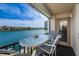 Relax on your private balcony with seating and waterfront views at 7645 Sun Island S Dr # 201, South Pasadena, FL 33707