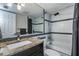 Modern bathroom featuring granite countertop, white subway tile with black accents, and a shower-tub combo at 7645 Sun Island S Dr # 201, South Pasadena, FL 33707