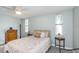 Inviting bedroom with wood furniture, soft light, and a peaceful ambiance at 7645 Sun Island S Dr # 201, South Pasadena, FL 33707