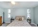 Cozy bedroom featuring a floral-patterned bed, soft lighting, and a tranquil atmosphere at 7645 Sun Island S Dr # 201, South Pasadena, FL 33707