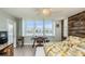 Bedroom featuring a workspace, intercoastal views, white shutters and a wood accent wall at 7645 Sun Island S Dr # 201, South Pasadena, FL 33707