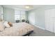 Serene bedroom featuring bright light, a calming view, and ample storage space at 7645 Sun Island S Dr # 201, South Pasadena, FL 33707
