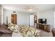 Bedroom featuring a ceiling fan, wood-look tile flooring, and entrance to another room at 7645 Sun Island S Dr # 201, South Pasadena, FL 33707
