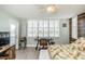 Bedroom featuring bright natural light, white shutters, ceiling fan, and a view of the intercoastal at 7645 Sun Island S Dr # 201, South Pasadena, FL 33707