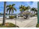 Well-maintained community grilling area with picnic tables and grills overlooking the tranquil waterway at 7645 Sun Island S Dr # 201, South Pasadena, FL 33707
