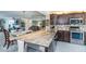 Modern kitchen with granite countertops, stainless steel appliances, and stylish mosaic tile backsplash at 7645 Sun Island S Dr # 201, South Pasadena, FL 33707
