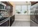 Bright kitchen with updated appliances, wood cabinets, and a lovely view from the window at 7645 Sun Island S Dr # 201, South Pasadena, FL 33707