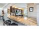 Kitchen bar with seating and granite countertops at 7645 Sun Island S Dr # 201, South Pasadena, FL 33707