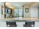 Kitchen bar with seating and granite countertops and expansive views at 7645 Sun Island S Dr # 201, South Pasadena, FL 33707