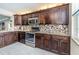 Kitchen featuring stainless steel appliances, granite countertops, and tile backsplash at 7645 Sun Island S Dr # 201, South Pasadena, FL 33707