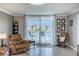 Cozy living room with lanai access and water views at 7645 Sun Island S Dr # 201, South Pasadena, FL 33707