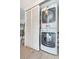 Convenient laundry closet with stacked washer and dryer units at 7645 Sun Island S Dr # 201, South Pasadena, FL 33707