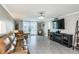 Spacious living room with a comfortable seating area and sliding glass doors to the lanai at 7645 Sun Island S Dr # 201, South Pasadena, FL 33707