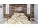 Cozy bedroom with a unique wooden wall and side tables at 7645 Sun Island S Dr # 201, South Pasadena, FL 33707