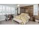 Comfortable bedroom with feature wall and natural light, creating a serene and relaxing atmosphere at 7645 Sun Island S Dr # 201, South Pasadena, FL 33707