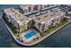 An eye-level aerial view highlights the pool, waterfront condo, and the building's landscaping and amenities at 7645 Sun Island S Dr # 201, South Pasadena, FL 33707