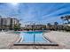 Take a dip in the community pool, surrounded by lush landscaping and beautiful views of the building at 7645 Sun Island S Dr # 201, South Pasadena, FL 33707