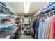 Organized walk-in closet featuring wire shelving, hanging rods, and ample storage space for clothes and accessories at 7645 Sun Island S Dr # 201, South Pasadena, FL 33707