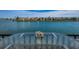 Gorgeous waterfront view with seashells on a glass table on the balcony at 7645 Sun Island S Dr # 201, South Pasadena, FL 33707