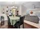 Open dining room with hardwood floors flowing into the living area, creating a cozy atmosphere at 803 Greenbelt Cir, Brandon, FL 33510