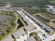 Aerial view of a townhome community featuring ponds and a swimming pool at 8512 Reedville St, New Port Richey, FL 34654