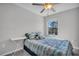 Cozy bedroom with natural light, a ceiling fan, and comfortable furnishings at 8512 Reedville St, New Port Richey, FL 34654