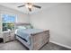 Bedroom featuring a window, ceiling fan, and neutral decor at 8512 Reedville St, New Port Richey, FL 34654
