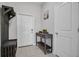 Welcoming entryway featuring neutral walls, tile flooring, and decorative furniture at 8512 Reedville St, New Port Richey, FL 34654