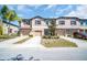 Attractive townhome exteriors with individual driveways and coordinated color schemes at 8512 Reedville St, New Port Richey, FL 34654