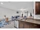 Modern kitchen with stainless appliances and an open view to the living area at 8512 Reedville St, New Port Richey, FL 34654