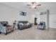 Bright living room showcasing tile floors, recessed lights, a ceiling fan, and comfortable seating at 8512 Reedville St, New Port Richey, FL 34654