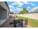 Brick paved patio includes grill, bordered by landscaping and a tall privacy fence at 867 Vino Verde Cir, Brandon, FL 33511